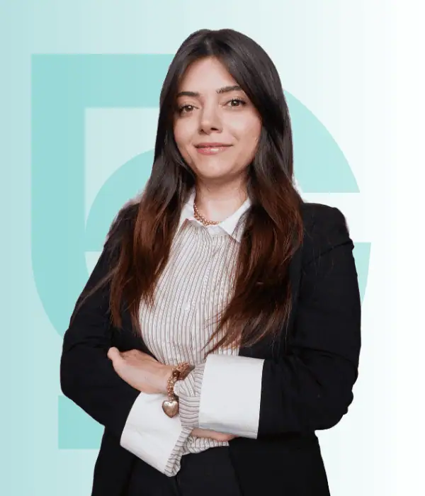 Healthcare professional at Acibadem Hospitals Group, smiling confidently.