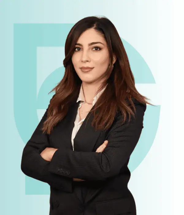 Hospital staff member in professional attire at Acibadem Hospitals Group.
