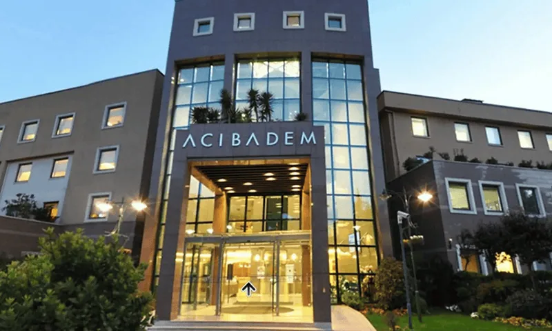 Acibadem Hospitals Group modern hospital exterior with glass facade and welcoming entrance.