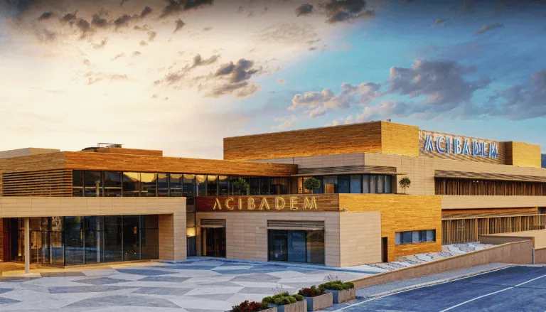 Acibadem Hospitals Group building exterior showcasing modern healthcare facilities.