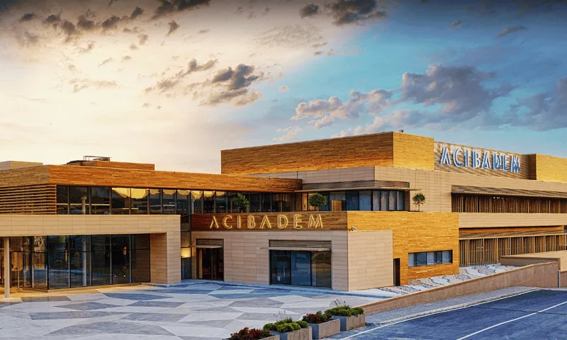 Acibadem Hospitals Group building exterior showcasing modern healthcare facilities.