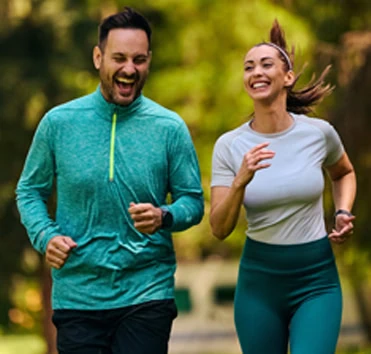 A couple jogging outdoors — illustration for Acibadem's targeted screening programmes
